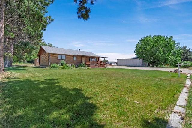 2974 Ua Ave, Emmett, ID 83617 - view of grassy yard with a wooden deck and an outbuilding