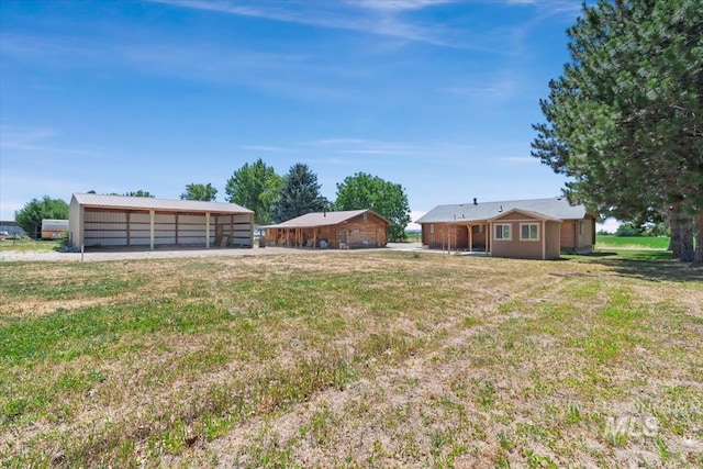 2974 Ua Ave, Emmett, ID 83617 - view of grassy yard with an outdoor structure, a pole building, and a garage