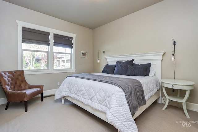 bedroom with carpet flooring and baseboards