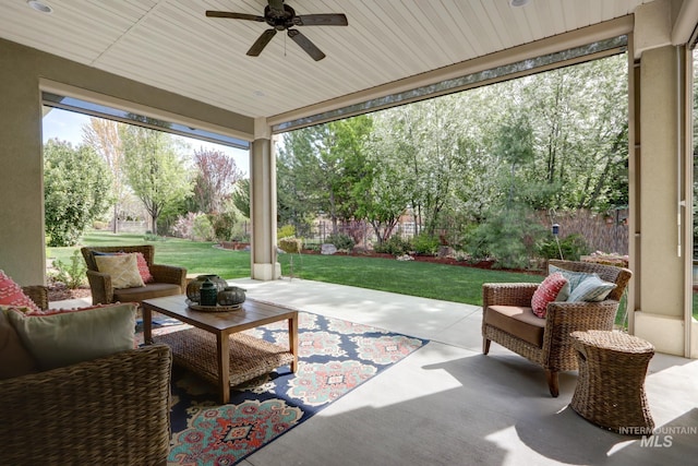 view of patio with fence, ceiling fan, and outdoor lounge area