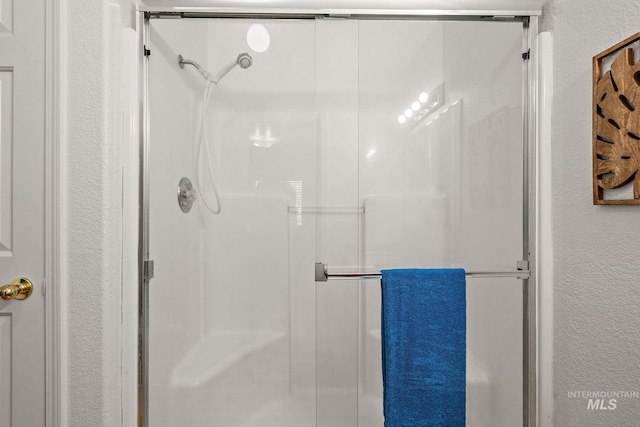 81 N Mirage St, Nampa, ID 83651 - bathroom with a textured wall and a stall shower