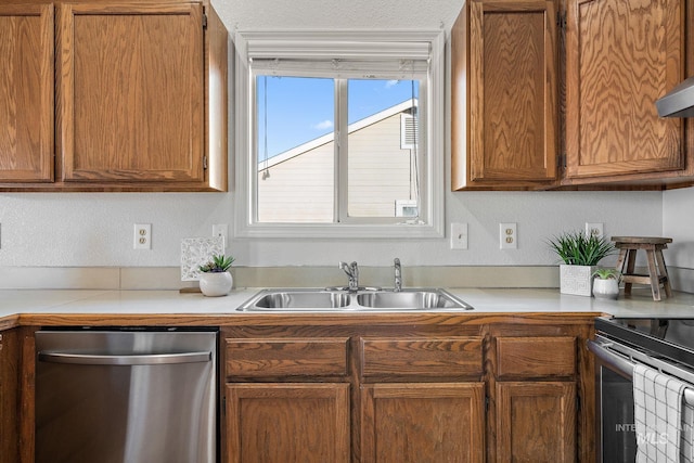 81 N Mirage St, Nampa, ID 83651 - kitchen featuring dishwasher, a sink, light countertops, brown cabinetry, and electric range