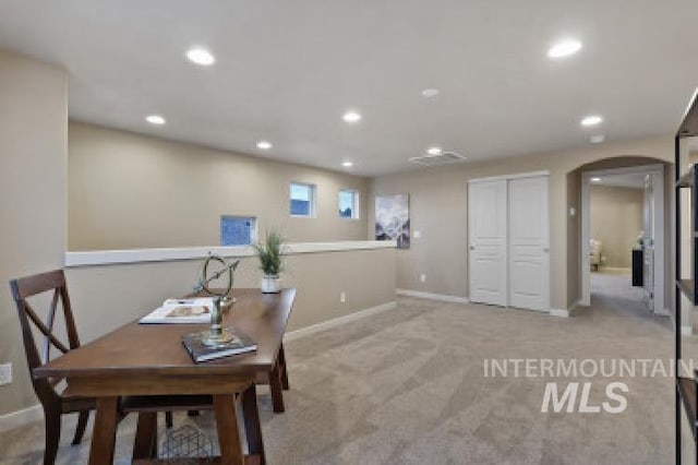 office area with carpet floors, baseboards, arched walkways, and recessed lighting