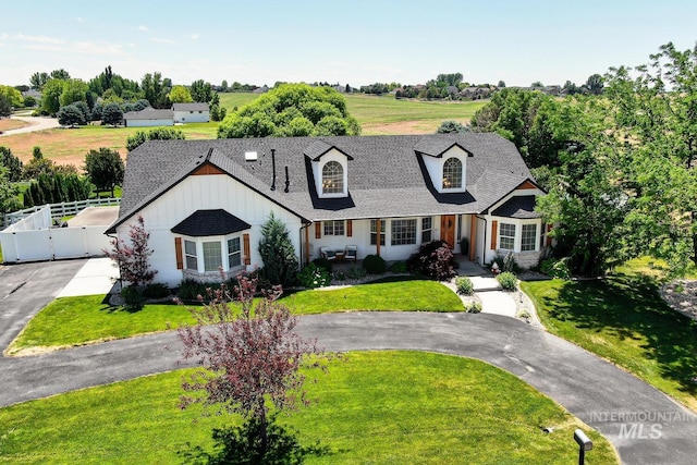 10551 W Deep Canyon Dr, Star, ID 83669 - view of front facade with a shingled roof, asphalt driveway, and a gate