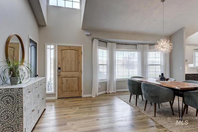 10551 W Deep Canyon Dr, Star, ID 83669 - entryway featuring a chandelier, light wood-type flooring, and a towering ceiling