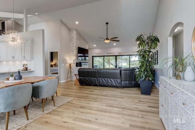 10551 W Deep Canyon Dr, Star, ID 83669 - living room with a ceiling fan, high vaulted ceiling, light wood finished floors, recessed lighting, and arched walkways