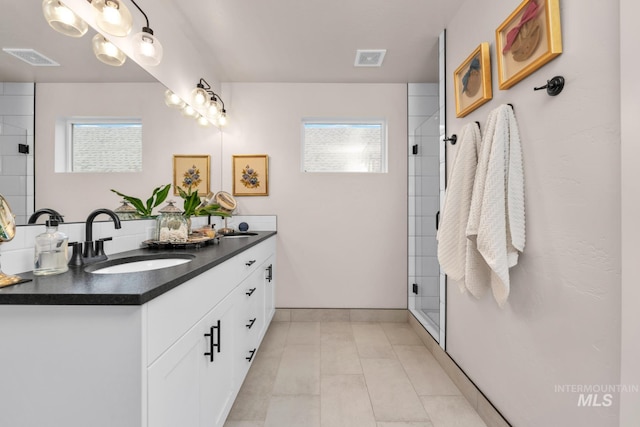 10179 Silversun St, Nampa, ID 83687 - full bath featuring double vanity, plenty of natural light, and a shower stall