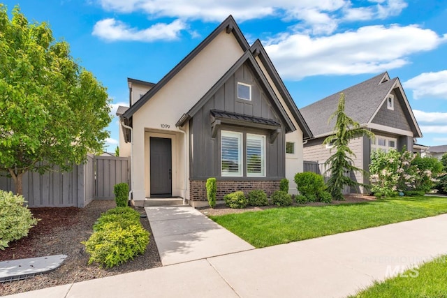 10179 Silversun St, Nampa, ID 83687 - view of front facade with board and batten siding and brick siding