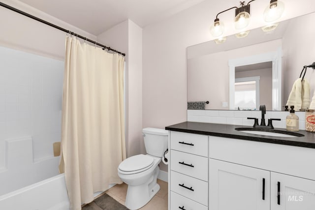 10179 Silversun St, Nampa, ID 83687 - full bathroom with toilet, vanity, shower / tub combo, and tile patterned floors