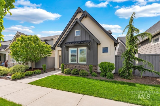10179 Silversun St, Nampa, ID 83687 - view of front facade featuring board and batten siding and brick siding