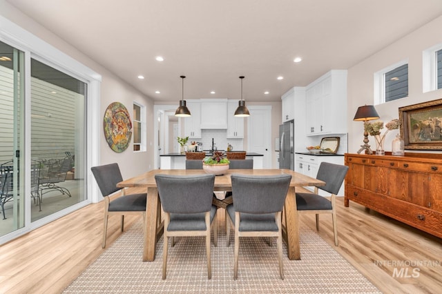 10179 Silversun St, Nampa, ID 83687 - dining area with light wood finished floors and recessed lighting