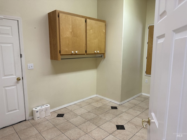 laundry room featuring light tile patterned flooring