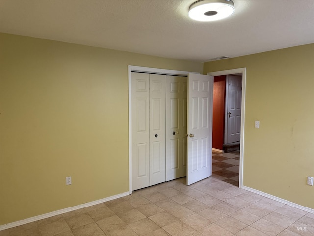 unfurnished bedroom featuring a closet