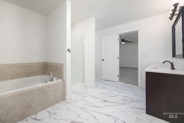 12476 W Kempshire Ct, Star, ID 83669 - bathroom with a garden tub, vanity, marble look tile flooring, a stall shower, and ceiling fan