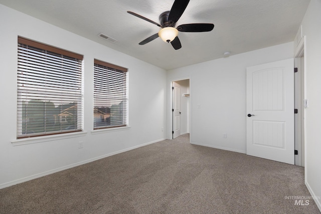 12476 W Kempshire Ct, Star, ID 83669 - unfurnished bedroom featuring carpet and a ceiling fan