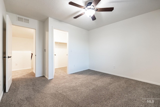 12476 W Kempshire Ct, Star, ID 83669 - unfurnished bedroom with carpet, a spacious closet, a closet, and ceiling fan
