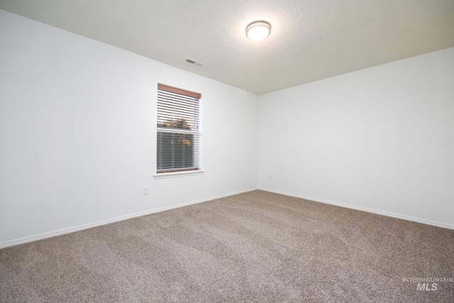 12476 W Kempshire Ct, Star, ID 83669 - empty room featuring carpet floors and baseboards