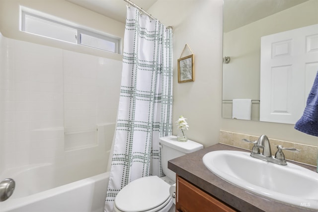 full bathroom with shower / bathtub combination with curtain, toilet, and vanity