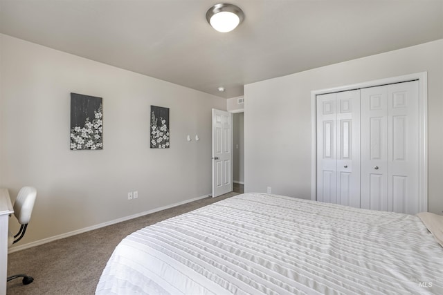 carpeted bedroom with a closet and baseboards