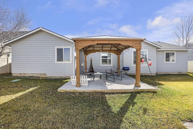 rear view of property with a gazebo, a yard, crawl space, and a patio