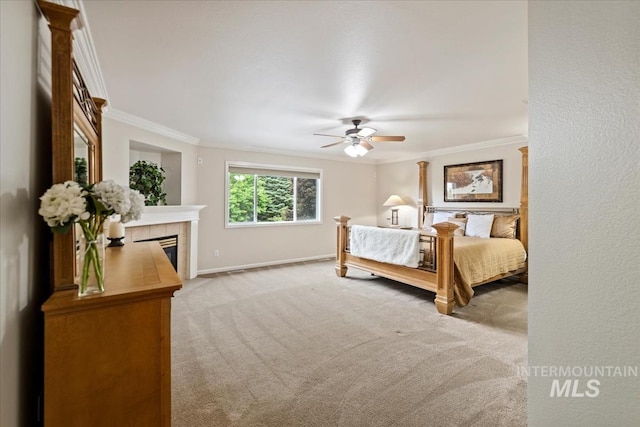 628 E Trinidad Dr, Meridian, ID 83642 - carpeted bedroom with ornamental molding, baseboards, a tile fireplace, and ceiling fan