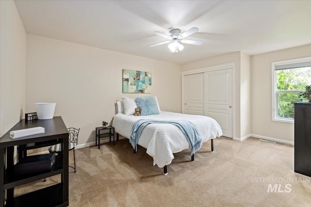 628 E Trinidad Dr, Meridian, ID 83642 - bedroom with light colored carpet, baseboards, a closet, and a ceiling fan