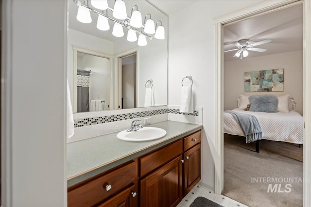 628 E Trinidad Dr, Meridian, ID 83642 - ensuite bathroom featuring vanity, ceiling fan, and backsplash