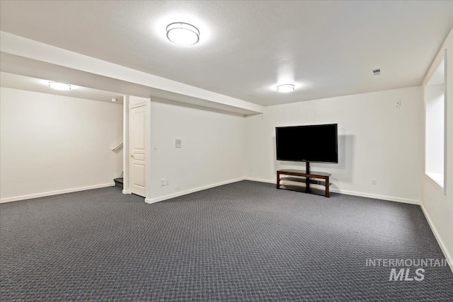 628 E Trinidad Dr, Meridian, ID 83642 - finished basement featuring dark colored carpet, baseboards, and stairs