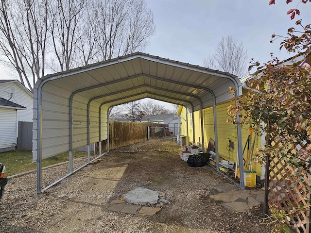 view of parking / parking lot featuring a carport