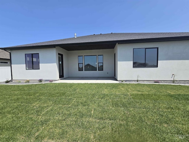 547 Full Moon Way, Twin Falls, ID 83301 - rear view of house with a patio, a lawn, and stucco siding