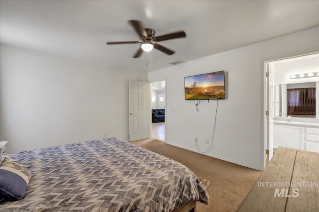 197 Cedarpark Cir, Twin Falls, ID 83301 - carpeted bedroom with connected bathroom, ceiling fan, and baseboards