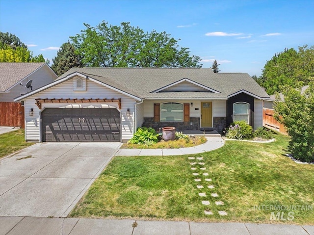 197 Cedarpark Cir, Twin Falls, ID 83301 - view of front of property featuring an attached garage, concrete driveway, roof with shingles, and stone siding