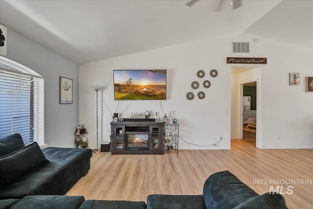 197 Cedarpark Cir, Twin Falls, ID 83301 - living room featuring vaulted ceiling, wood finished floors, and a ceiling fan