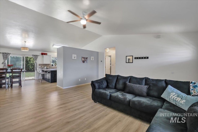197 Cedarpark Cir, Twin Falls, ID 83301 - living room featuring ceiling fan, light wood finished floors, vaulted ceiling, and baseboards