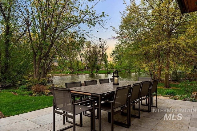1040 W Bogus Vw, Eagle, ID 83616 - view of patio / terrace with a water view and outdoor dining space
