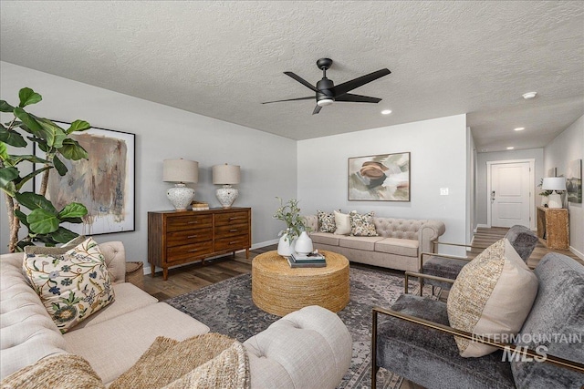 4849 N Willowside Ave, Meridian, ID 83646 - living area featuring wood finished floors, ceiling fan, recessed lighting, baseboards, and a textured ceiling