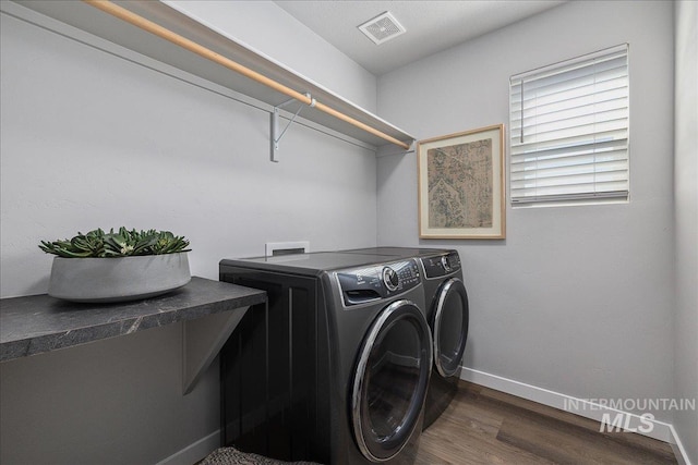 4849 N Willowside Ave, Meridian, ID 83646 - laundry area with washer and dryer, baseboards, and wood finished floors