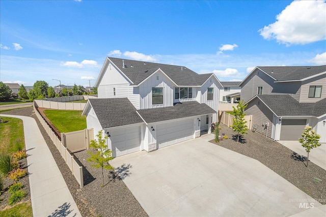 4849 N Willowside Ave, Meridian, ID 83646 - view of front of house with a residential view, board and batten siding, driveway, and an attached garage
