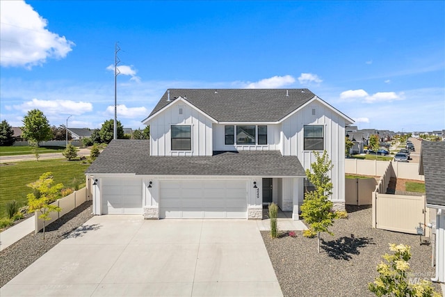 4849 N Willowside Ave, Meridian, ID 83646 - modern farmhouse with board and batten siding, roof with shingles, driveway, stone siding, and an attached garage