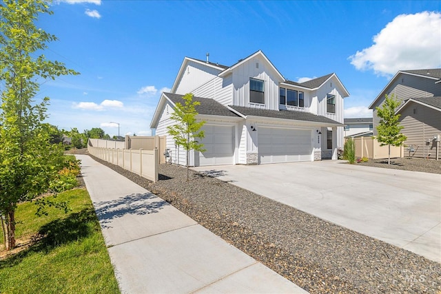 4849 N Willowside Ave, Meridian, ID 83646 - view of front facade featuring concrete driveway, a garage, board and batten siding, and stone siding