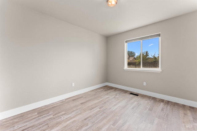 5291 N Midnight Haze Way, Meridian, ID 83646 - empty room with light wood finished floors