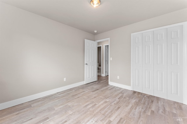 5291 N Midnight Haze Way, Meridian, ID 83646 - unfurnished bedroom featuring light wood-type flooring and a closet