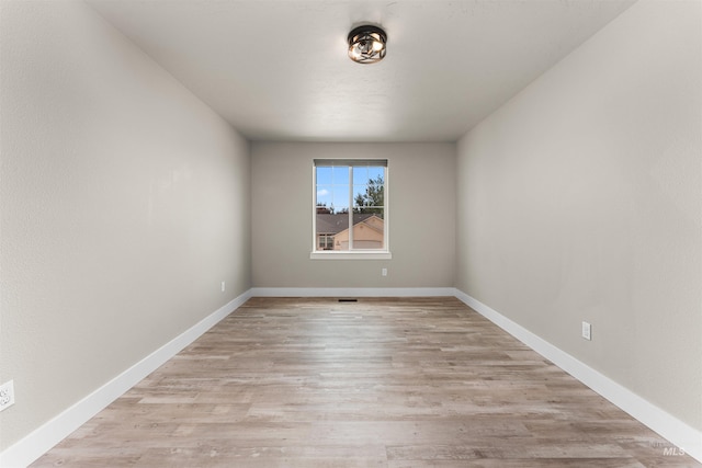 5291 N Midnight Haze Way, Meridian, ID 83646 - unfurnished room with light wood finished floors