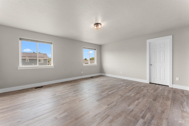 5291 N Midnight Haze Way, Meridian, ID 83646 - spare room with wood finished floors and baseboards