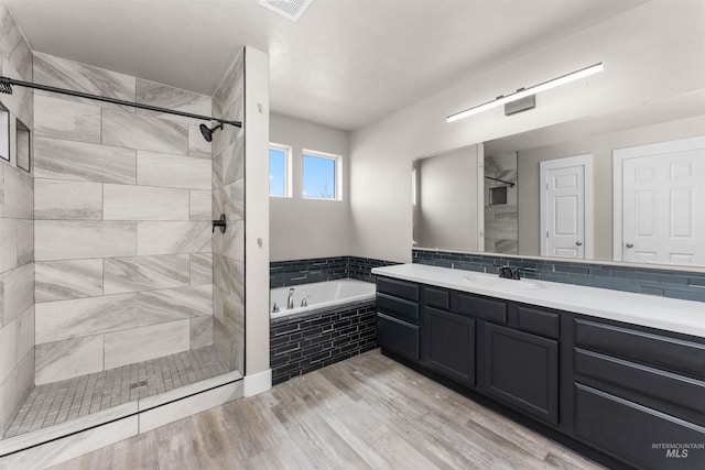 5291 N Midnight Haze Way, Meridian, ID 83646 - full bath with a bath, vanity, a stall shower, and wood finished floors