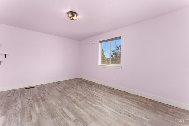 5291 N Midnight Haze Way, Meridian, ID 83646 - empty room featuring wood finished floors