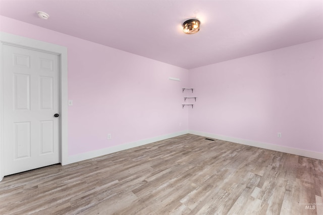 5291 N Midnight Haze Way, Meridian, ID 83646 - empty room with light wood-style floors and a smoke detector