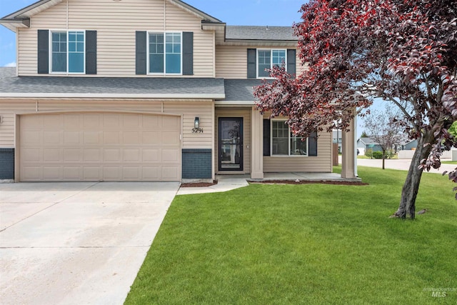 5291 N Midnight Haze Way, Meridian, ID 83646 - view of front facade with a front yard, concrete driveway, a garage, and roof with shingles