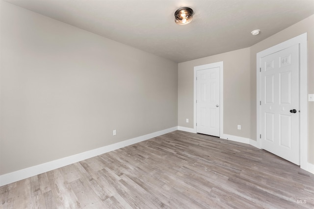 5291 N Midnight Haze Way, Meridian, ID 83646 - unfurnished bedroom with light wood-type flooring