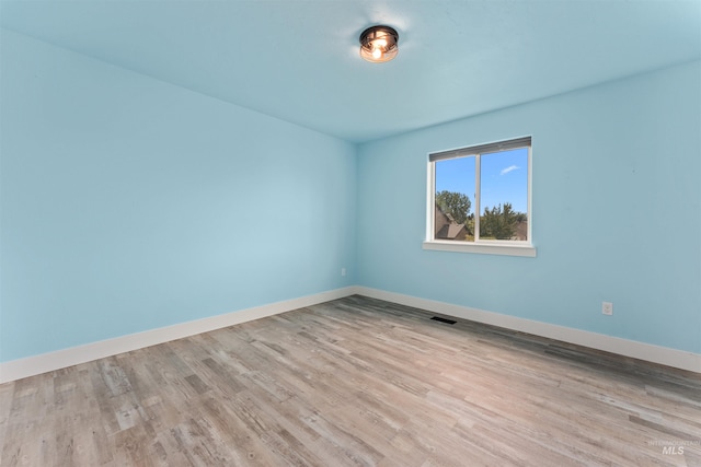 5291 N Midnight Haze Way, Meridian, ID 83646 - spare room with wood finished floors and baseboards